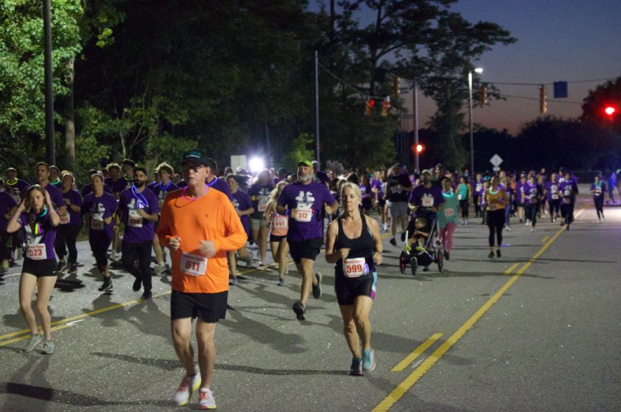 The group of 5k runners and walkers began promptly at 7:30 p.m. for the race.