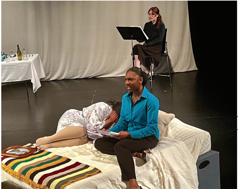 (Front sitting) Kassidy Young, (Front Laying) Selena Mancini, and
(Back) Ryanne Forrest performing “Freedom Summer” Feb.10-11 in
the Edwards Black Box Theater.