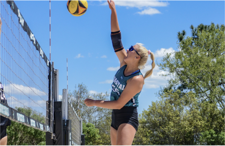 No. 55 junior Madie Lichty spikes the ball at the at the Seminole Beach Bash.