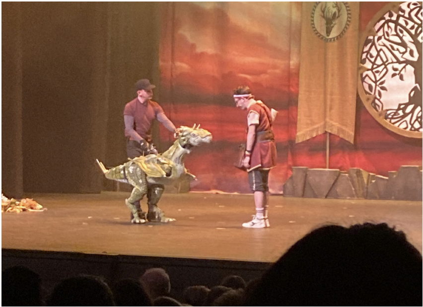 Hero-trainer Dave, played by Ben Galpin and his trusty wren dragon pet
George, the comic relief.