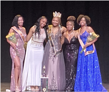 Crowning royalty at Miss Black and Gold pageant