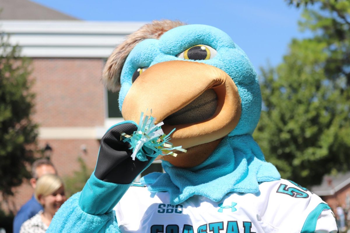 Mascot Chauncey pretends to blow into a noise maker Sept. 20 at Coastal Carolina Universitys birthday bash celebrating 69 years of the institution. Read more on page 2 on the celebration.