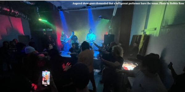 Angered show-goers demanded that a belligerent performer leave the venue.