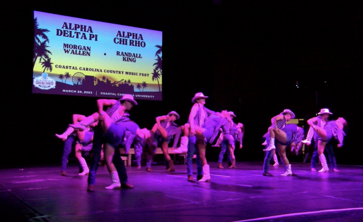Members of Alpha Chi Rho (AXP) performing with Alpha Delta Pi for Chant Rock on April 2.