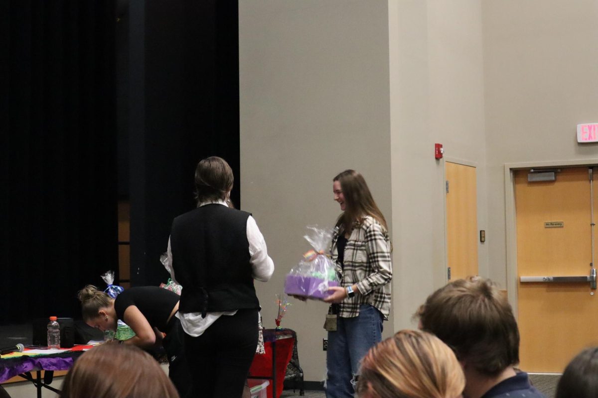 Student Receiving Their Bingo Prize.