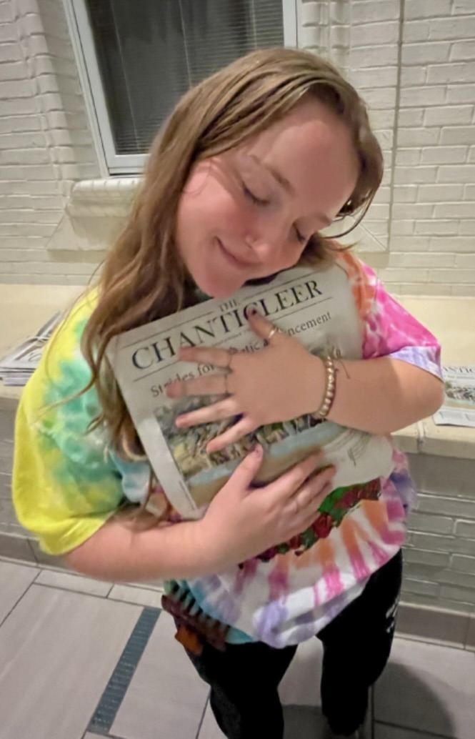 Editor-in-Chief Madison Sharrock with the first issue of the fall 2023 semester.