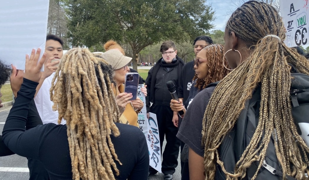 Senior Kaci Dozier speaks with Pam Hemphilll, Ex Maga Granny, at a protest regarding the universitys
communication about presidential candidate Trump.
