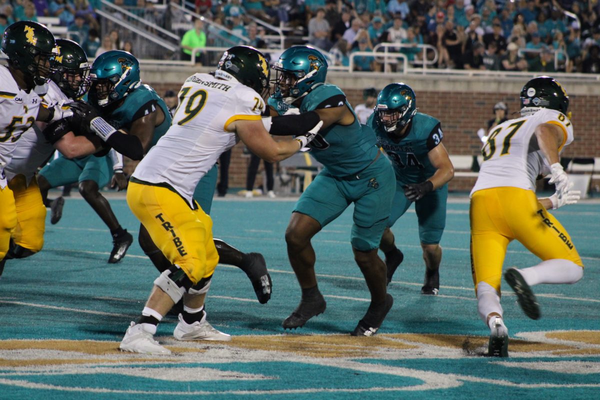 The Chanticleers holding a strong block against the William and Mary Tribe.