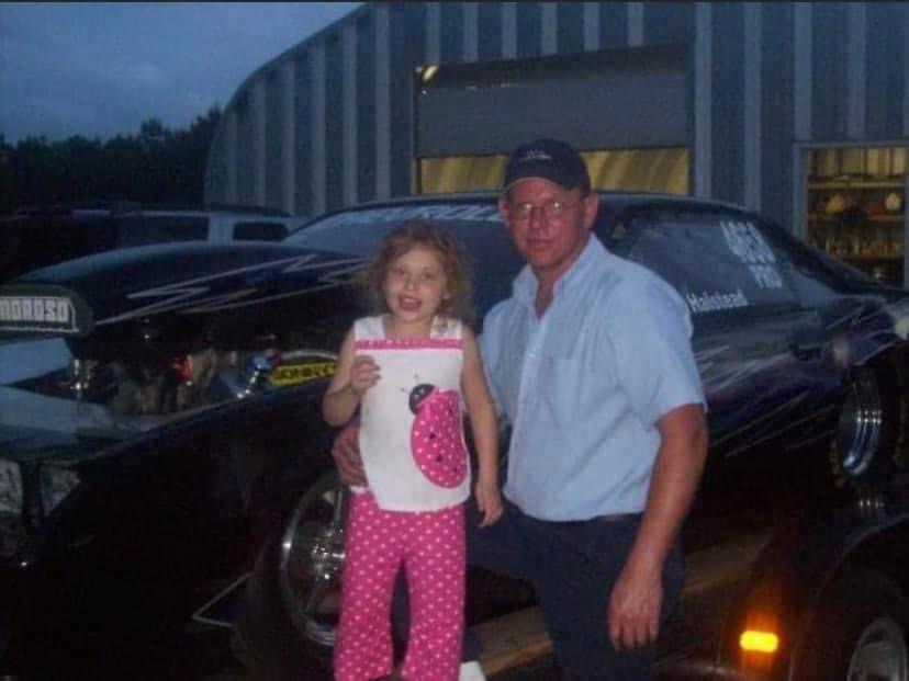 Ashley Yarborough, 6, next to her dad, Ricky, at his car shop in Florence, South Carolina. Photo provided by Ashley Yarborough.