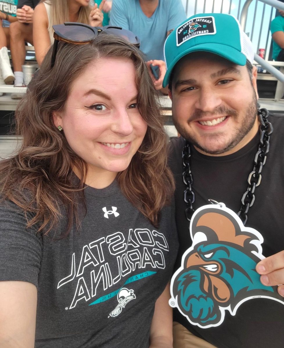 Jennifer Schlosser and Jeff Piasecki watch the CCU football game from the stands before the proposal. Photo provided by Jennifer Schlosser.