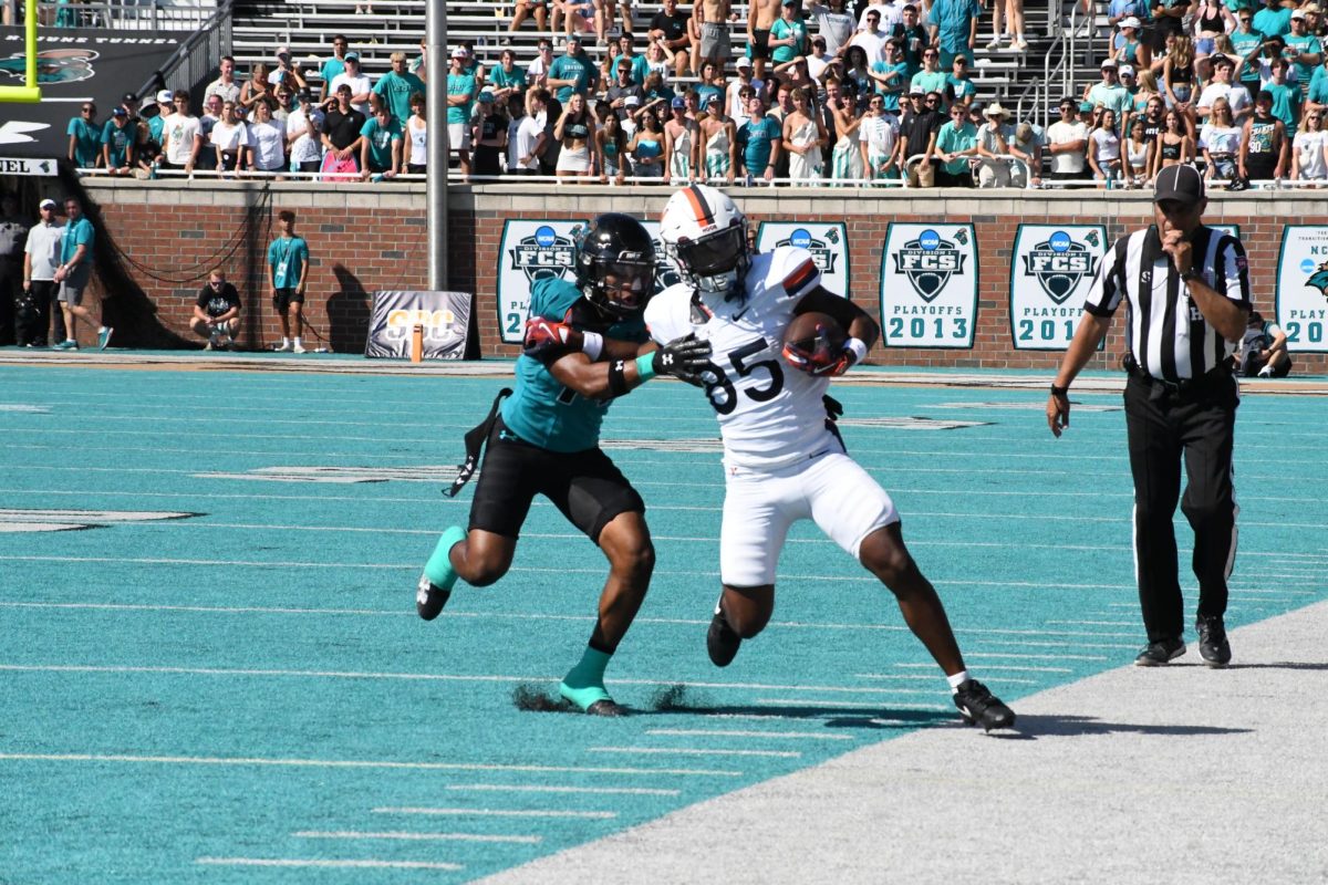 Myles Woods drives a Cavalier out of bounds.