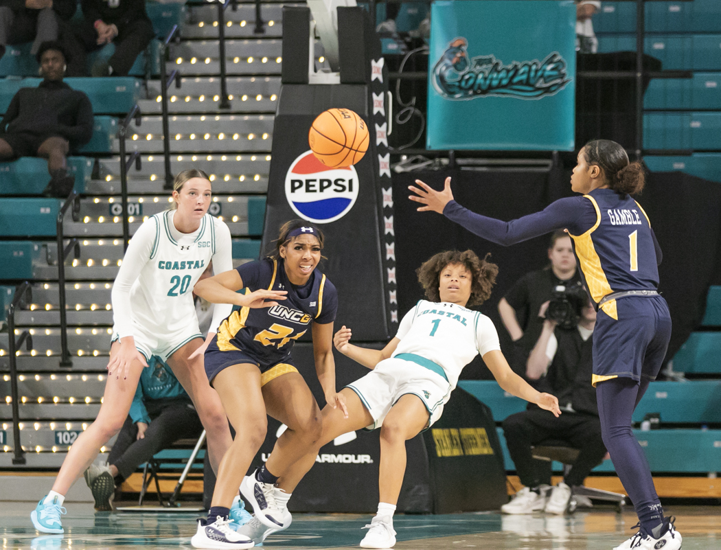 Dalanna Carter, guard, falls after making contact with UNCG.