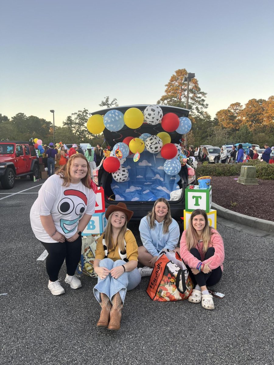 Members of Teaching Fellows Program pose with their trunk.