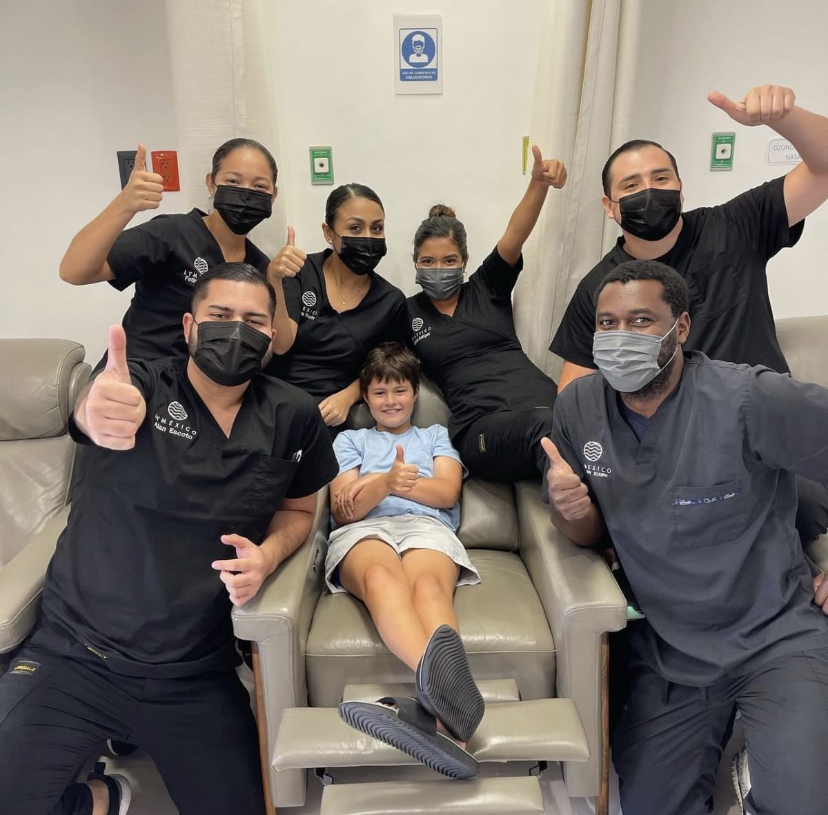 The staff at Lyme Clinic Mexico surround Whitman Spires. They cheered him on during the various treatments. Photo provided by Hannah Spires.