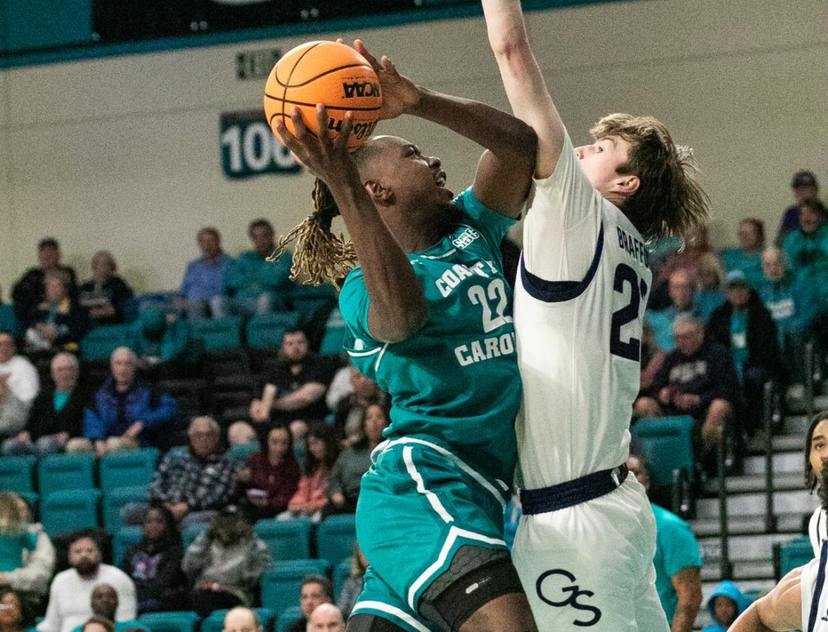 Denzel Hines, forward, makes a drive to the basket.