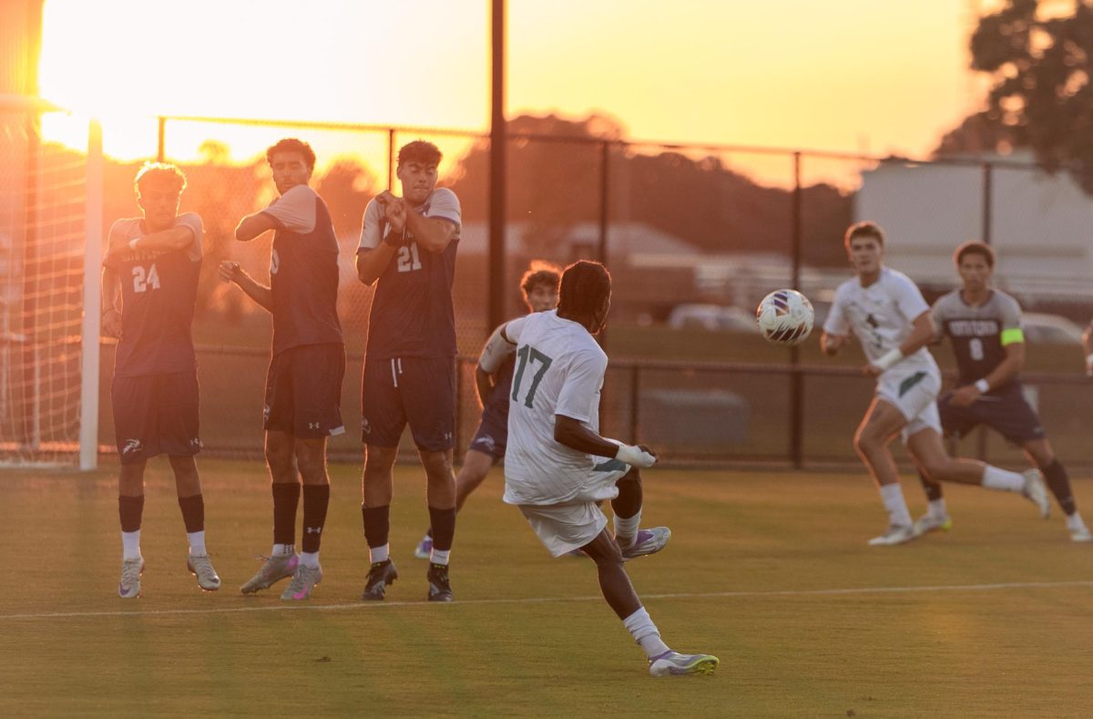 Jaland Larmond, midfielder, takes a free kick. 