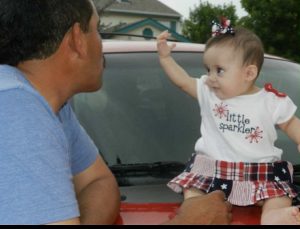 "Papa" celebrates his granddaughter's first Independence Day. 
Photo provided by interviewee: