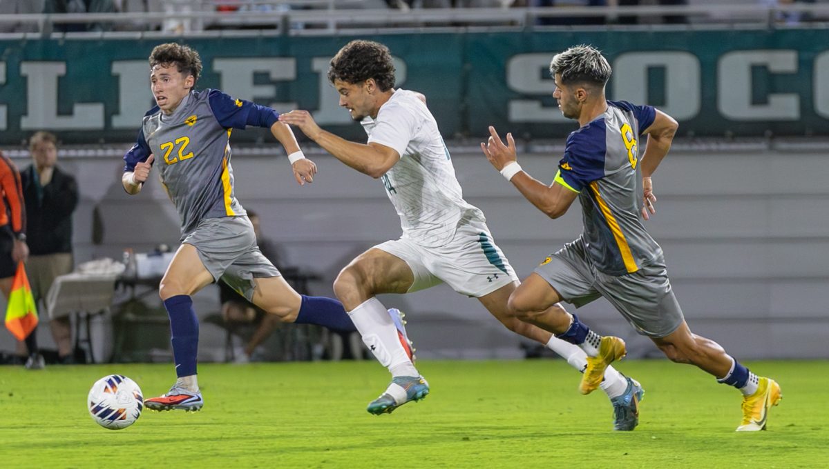 Forward Dominic Cintra makes a break towards the Mountaineers goal