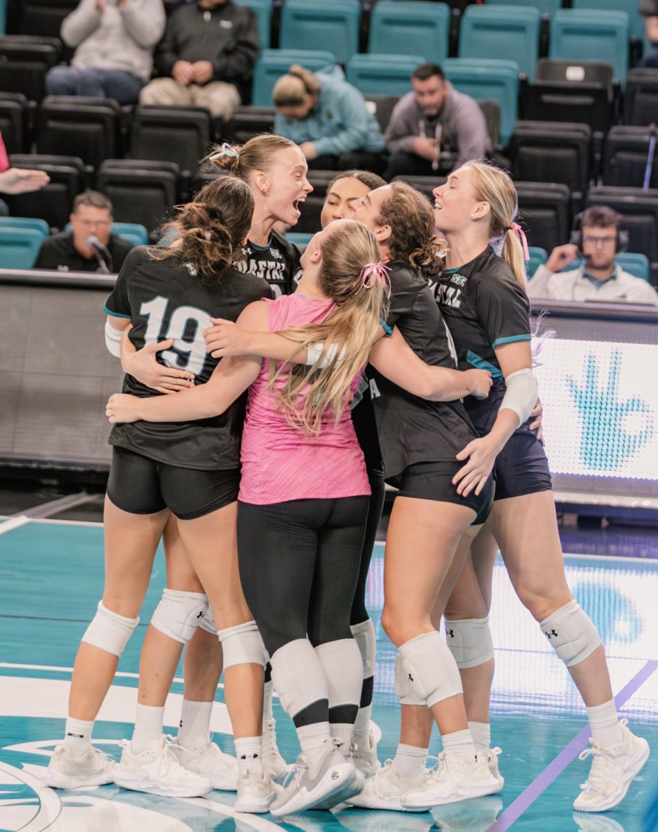 The Chanticleers celebrate their win over Old Dominion
