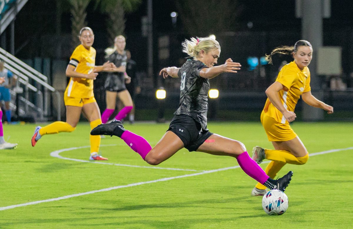 Forward Olivia Goretski takes a shot on the Mountaineers goal