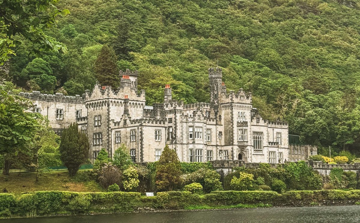 Kylemore Abbey, located in Connemara, Ireland during an overcast day.  