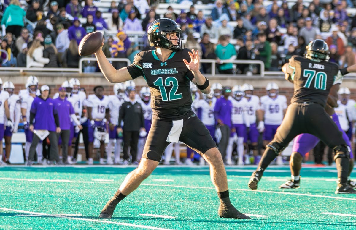 Coastal Carolina quarterback Tad Hudson looks for an opening downfield. 