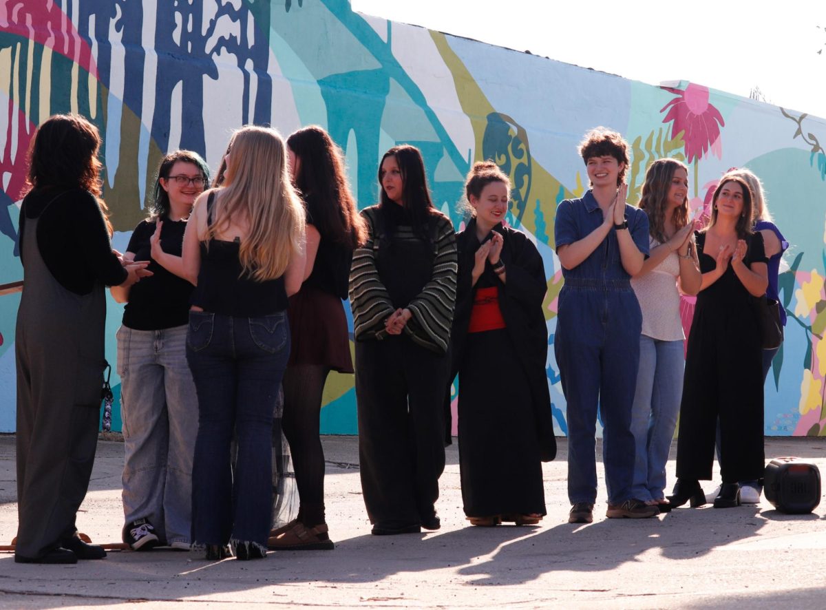 Coastal students celebrate as the Laurel Street Mural is unveiled to the public.