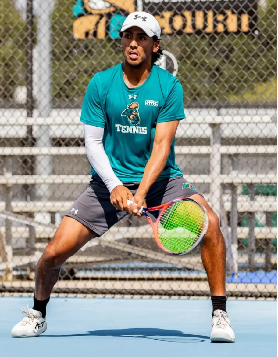 Eric Tripathi readies himself for a serve from an opponent. Photo courtesy of GoCCUSports.