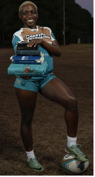 Curriyah Scott poses with her bibles, displaying her dedication to 
faith and athletics.
Photo provided by Curriyah Scott on Instagram