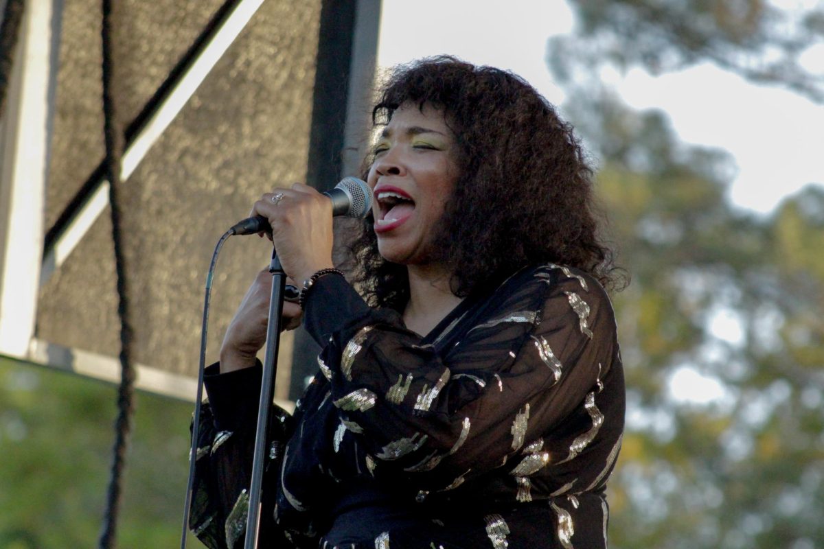 Candice Ivory singing on Prince Lawn. 